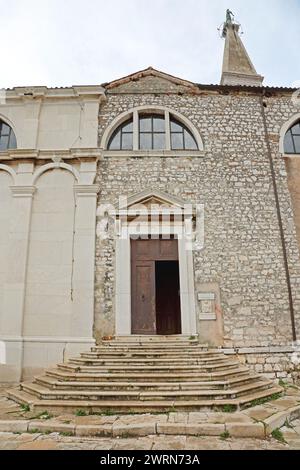 Rovinj, Croatia - October 15, 2014: Entrance to Church of Saint Euphemia Basilica at Top of Hill in Old Town. Stock Photo