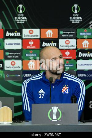 Solun, Hrvatska. 13th Mar, 2024. Player of GNK Dinamo Zagreb Josip Misic speaks on a press conference at Toumba Stadion on 13. March 2024. in Solun, Greece ahead of the return match of the 1/8 finals of the UEFA Conference League between PAOK and GNK Dinamo. Photo: Marko Lukunic/PIXSELL Credit: Pixsell/Alamy Live News Stock Photo