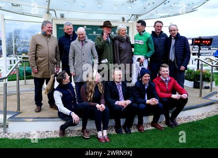 Trainer Willie Mullins, wife Jackie Mullins, jockey Patrick Mullins, Ruby Walsh and their connections pose for a photo as they celebrate after Jasmin De Vaux wins the Weatherbys Champion Bumper on day two of the 2024 Cheltenham Festival at Cheltenham Racecourse. Willie Mullins reached the magical 100-winner mark at the Cheltenham Festival as the Patrick Mullins-ridden Jasmin De Vaux provided him with a 13th victory in the Weatherbys Champion Bumper. Picture date: Wednesday March 13, 2024. Stock Photo