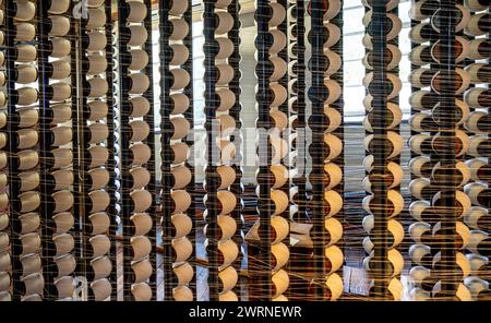 Bobbin rack in a cotton mill. Quarry Bank Mill. Cheshire, UK Stock Photo