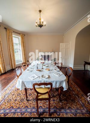 Dining room with table set for dinner at Quarry Bank House. Styal. Cheshire. Stock Photo