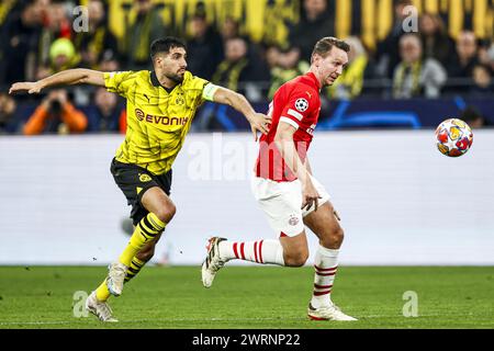 DORTMUND - (l-r) Emre Can of Borussia Dortmund, Luuk de Jong of PSV Eindhoven during the UEFA Champions League last 16 match between Borussia Dortmund and PSV Eindhoven at Signal Iduna Park on March 13, 2024 in Dortmund, Germany. ANP MAURICE VAN STEEN Stock Photo