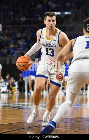 South Dakota State Jackrabbits forward Luke Appel (13) makes a move with the ball during the men's final at the Summit League basketball tournament between the Denver Pioneers and the South Dakota State Jackrabbits at the Denny Sanford Premier Center in Sioux Falls, South Dakota on Tuesday, March 12, 2024. South Dakota State defeated Denver 76-68.Russell Hons/CSM. Stock Photo