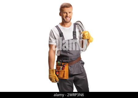 Electrician in a uniform carrying cables on his shoulder isolated on white background Stock Photo