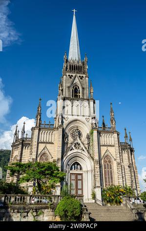 Full view of the main entrance and facade of Cathedral of Petropolis church in Centro district under summer afternoon sunny clouded blue sky. Stock Photo