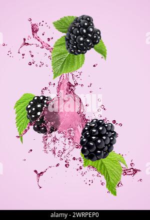 Fresh blackberries and juice in air on violet background Stock Photo