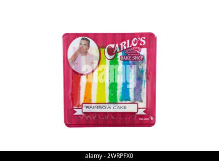 Ocala, Fl 3-2-2024 Carlos bake shop since 1910 is a family owned bakery featured on the TLC hit show Cake Boss. rainbow layer cake.  Isolated on white Stock Photo