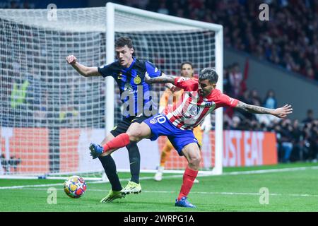Madrid, Spain. 13th Mar, 2024. Atletico Madrid's Angel Correa (R) vies with Inter Milan's Benjamin Pavard during the UEFA Champions League round of 16 second leg match between Atletico Madrid and Inter Milan in Madrid, Spain, March 13, 2024. Credit: Gustavo Valiente/Xinhua/Alamy Live News Stock Photo