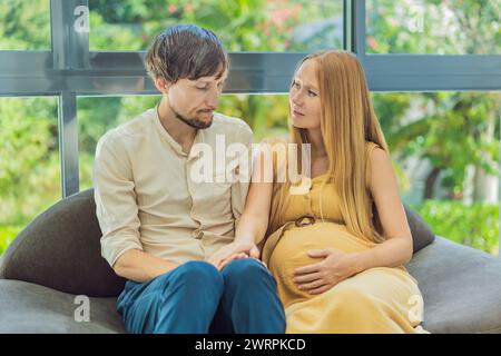 Concerned husband anxiously worries about his wife's pregnancy, seeking reassurance and support Stock Photo