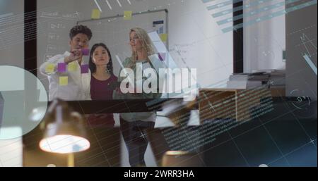 Image of financial data processing over diverse business people working in office Stock Photo