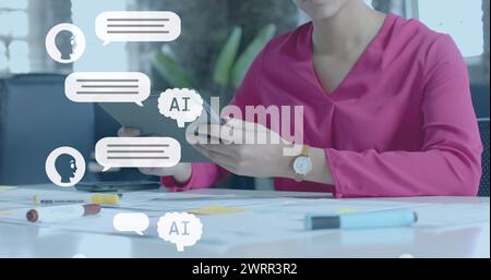 Image of digital ai chat over biracial businesswoman using tablet in office Stock Photo