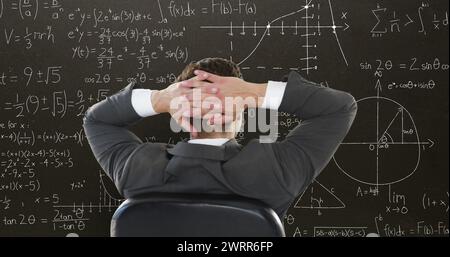 Student with hands behind head amid floating math equations in 4k back-to-school image. Stock Photo