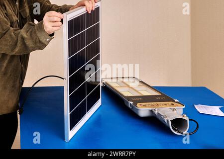 Outdoor Led Solar Street Light, mounting panel and lamp to bracket for subsequent mounting to pole or wall. Stock Photo