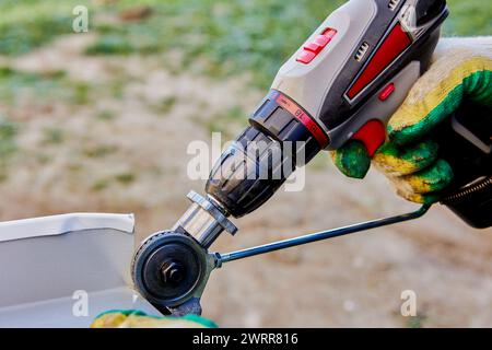 Electric drill shears plate cutter attachment metal sheet cutter nibbler saw. Stock Photo