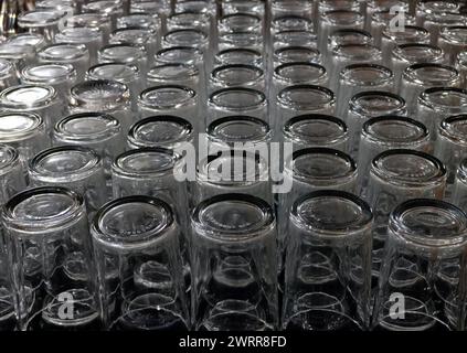 glasses made of glass are neatly arranged on the table Stock Photo