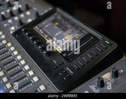 Professional audio mixing console with faders and adjusting knobs Stock Photo