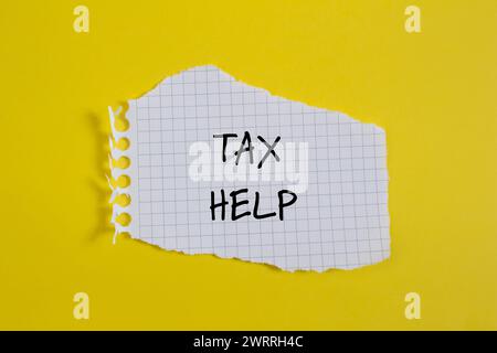 Tax help words written on wooden blocks with purple background ...