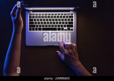 Top view of man hand using laptop at late night. Stock Photo