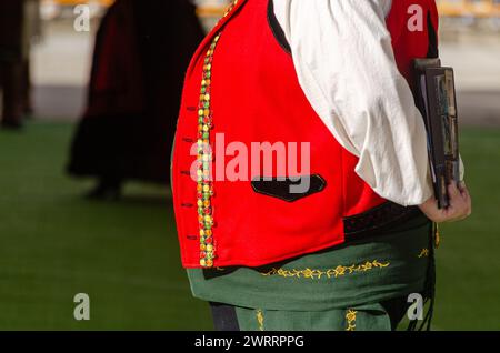 partial view of man at a music event in traditional Galician costume Stock Photo