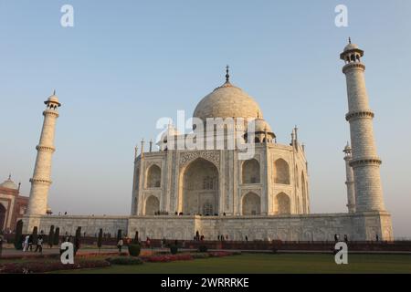 Agra, Uttar Pradesh, India, March 11, 2019: Side shot of the Taj Mahal at sunrise, peaceful morning mood with few people. Stock Photo