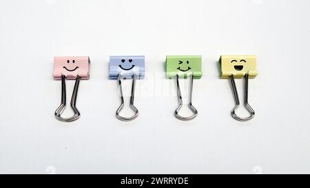 Binder clips, colorful paper clips on a white background Stock Photo
