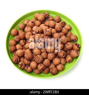 shagbark hickory nuts on white background Stock Photo