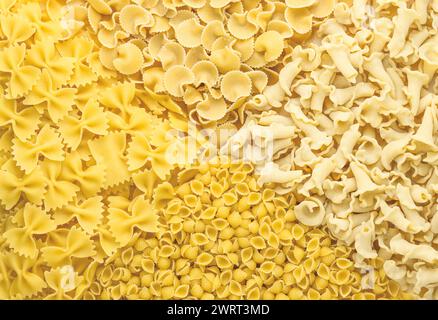 Background of different pasta types. Concept of culinary, food backgrounds. The view from the top Stock Photo