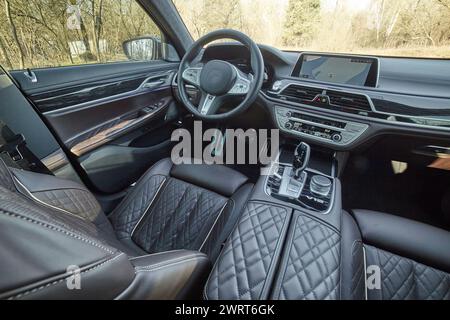 Inside moden car background, luxury car interior elements wallpaper. Black leather car interior Stock Photo