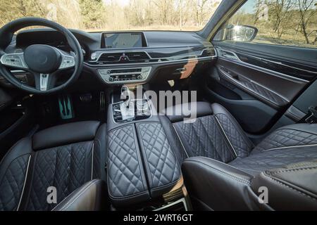 Inside moden car background, luxury car interior elements wallpaper. Black leather car interior Stock Photo