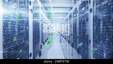 Image of icon in circles over binary codes on data server racks in server room Stock Photo