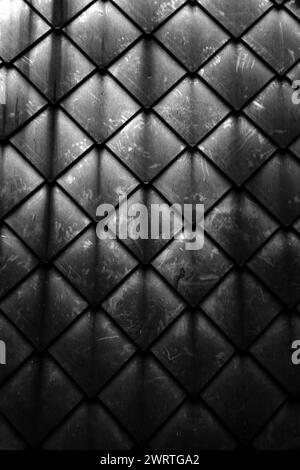 Diamond shaped fish scale tiled wall texture background close up Stock Photo