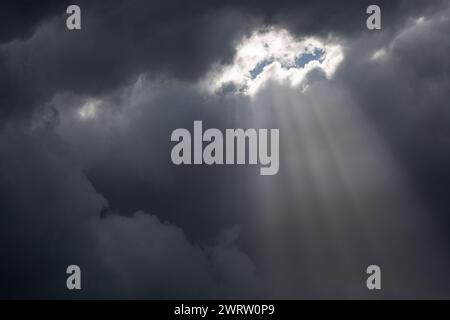 Sun burst through storm clouds, uk Stock Photo