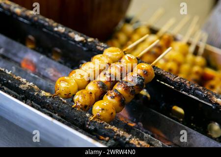 Grilled Sticky Rice Ball in street kiosk. Traditional Japanese food Mochi Stock Photo