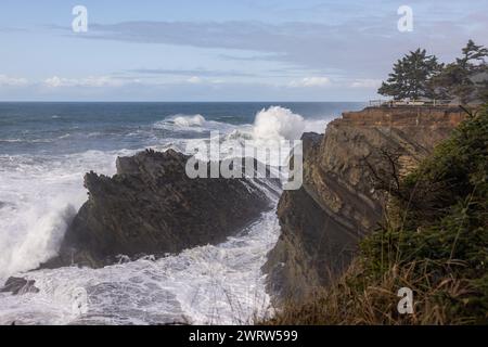 Shore Acres is a very popular place to watch giant waves crash against the rocky shore line. Stock Photo