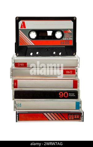 Close-up of many audio tapes. Analog storage medium. Cassettes for audio recordings and music. Isolate on a white background. Stock Photo