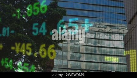 Image of financial data processing over modern office buildings Stock Photo