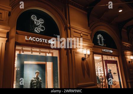 Facade and logotype of Lacoste brand retail shop singboard on the storefront in the shopping mall Stock Photo