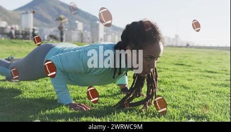 Image of rugby ball icons over biracial woman exercising in park Stock Photo