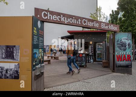 September 2022 -Checkpoint Charlie Landmark boundary marking east & west Berlin with a white sentry guard house & cobbled border line in Berlin, capit Stock Photo
