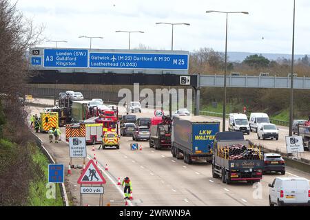 A road traffic accident on the approach to Junction 10, Wisley on the M25 motorway with emergency services in attendance Surrey England UK Stock Photo