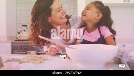 Image of lol texts over happy caucasian mother with daughter baking Stock Photo