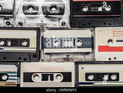 Photo of pile of old audio tape cassettes laying on flat surface. Stock Photo