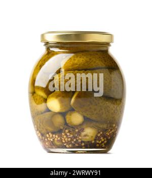 Canned cucumbers in a closed glass jar, isolated on a white background, close-up. Pickled gherkins. Stock Photo