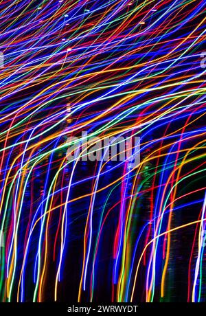 Coloured lights  out of focus on a dark evening, including shots with bokeh, out of focus and zoomed Stock Photo