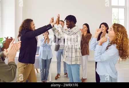 Group of happy diverse multiethnic business colleagues having fun at work in office Stock Photo