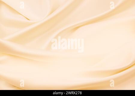 Ripples in orange silk fabric Stock Photo