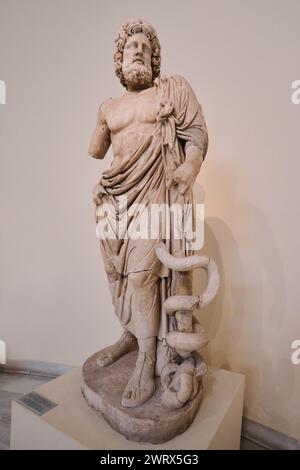 Athens, Greece - March 03, 2024: Ancient statue of Asklepios, National Archaeological Museum of Athens. Found in Sanctuary of Asklepios, in Epidauros Stock Photo