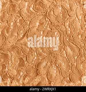 Seamless texture photo of beige cotton lace floral patterned material on white backdrop. Stock Photo