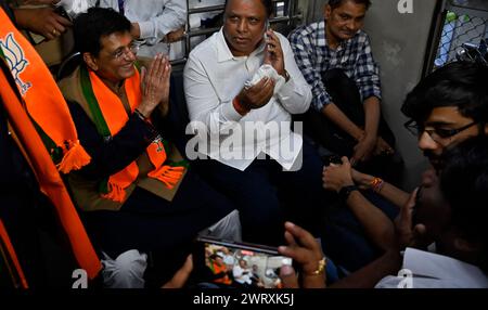 Mumbai, India. 14th Mar, 2024. MUMBAI, INDIA - MARCH 14: Piyush Goyal, Minister of Textiles, Minister of Commerce and Industry and Minister of Consumer Affairs, Food and Public Distribution shares the light moment with co-passenger while traveling between Dadar Railway Station to Borivali Railway Station in 2nd Class compartment, during evening peak hours at Dadar Station, on March 14, 2024 in Mumbai, India. (Photo by Anshuman Poyrekar/Hindustan Times/Sipa USA ) Credit: Sipa USA/Alamy Live News Stock Photo