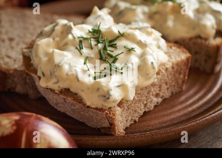 A slice of sourdough bread with spread made of leftover Easter eggs and cottage cheese Stock Photo